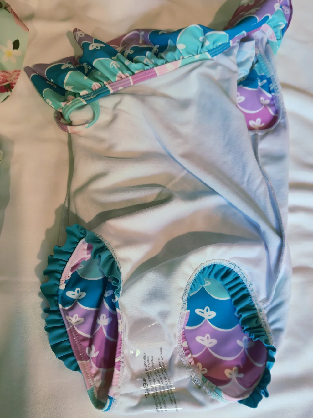 Rufflebutts Pastel Wave One-Shoulder Swimsuit in Teal, Lavender, Pink